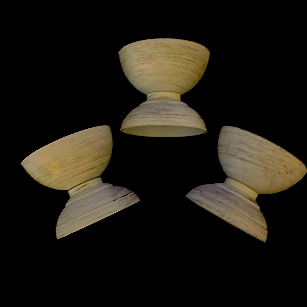 Three grey candle holders